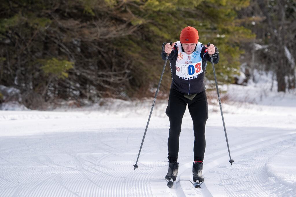 An athlete skiing in the snow