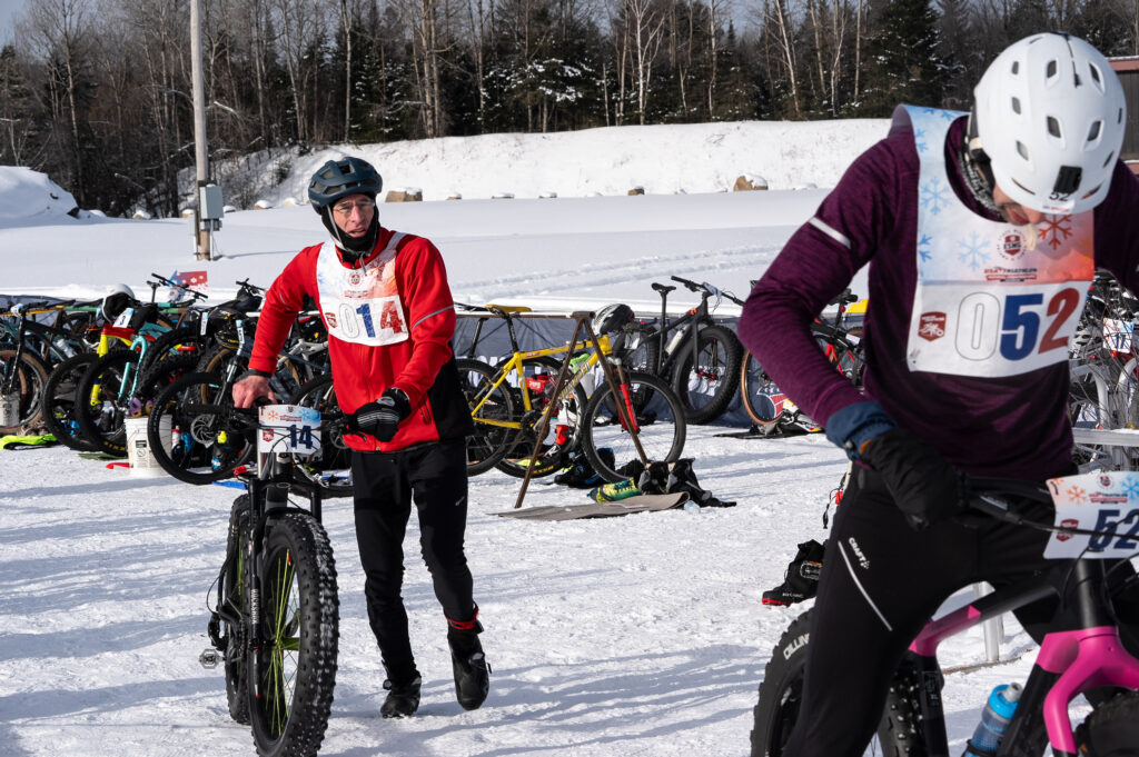 Two athletes competing in athletic event sports with helmet