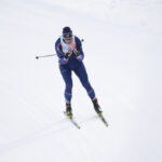 An athlete skiing in the snow