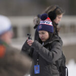 A group of athletes competing in athletic event sports outdoors