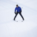 An athlete skiing in the snow