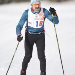 An athlete skiing in the snow